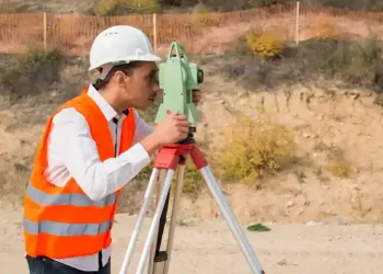 surveyor-engineer-worker-making-measuring-with-theodolite-instrument-equipment